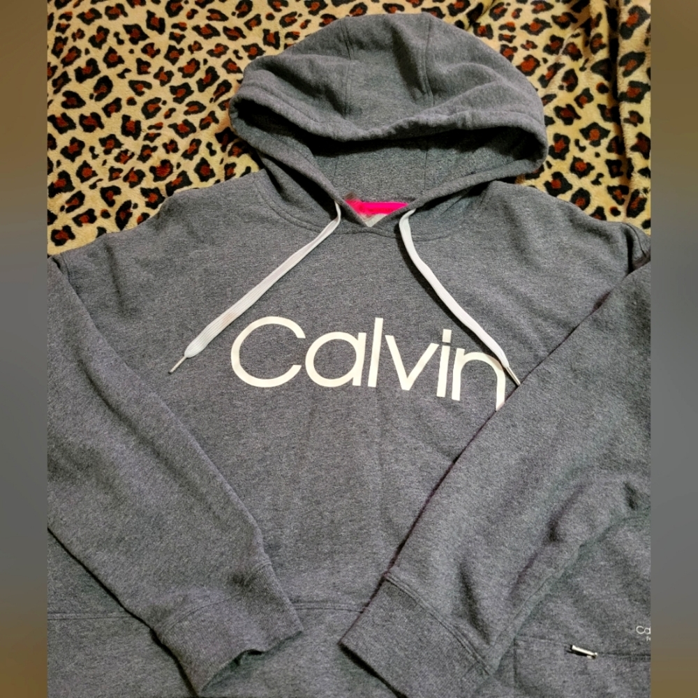 Womans Calvin Klein cropped performance hoodie .Has small zippered pocket .